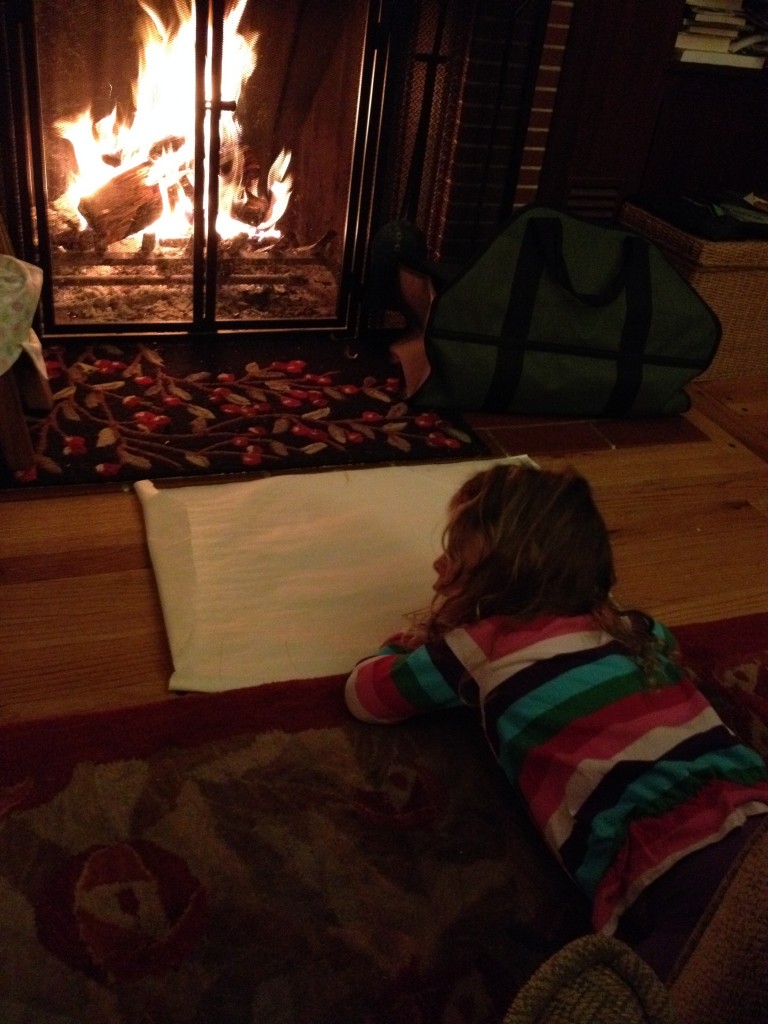 CH drawing in front of fireplace