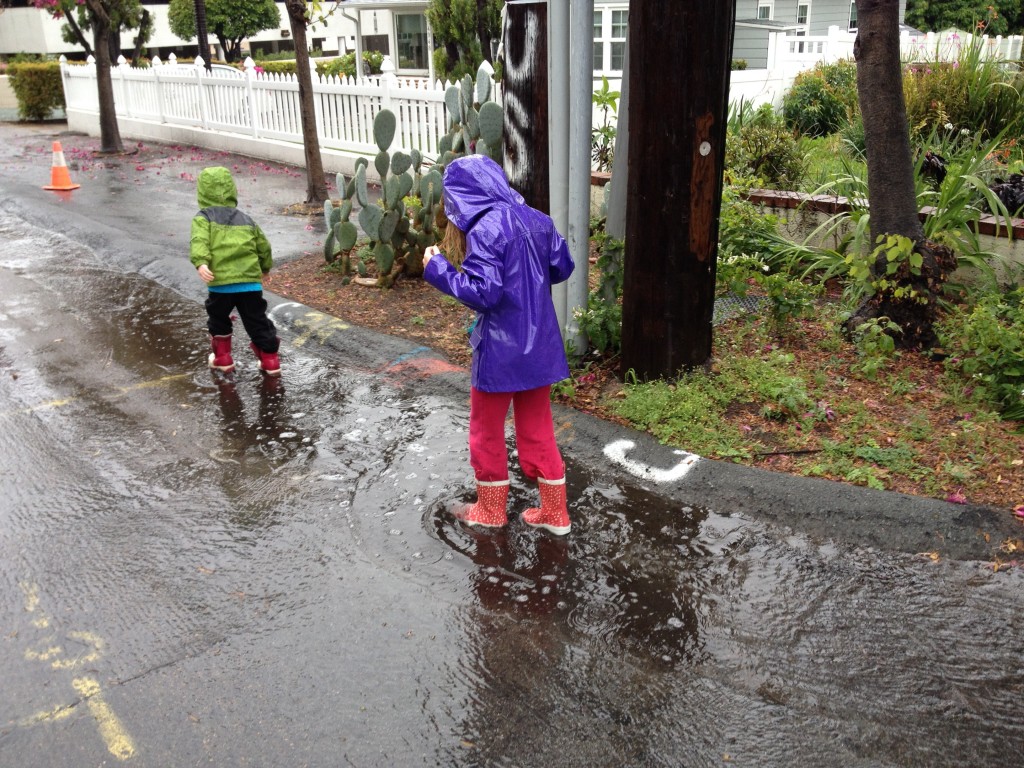 Kids walking in puddles